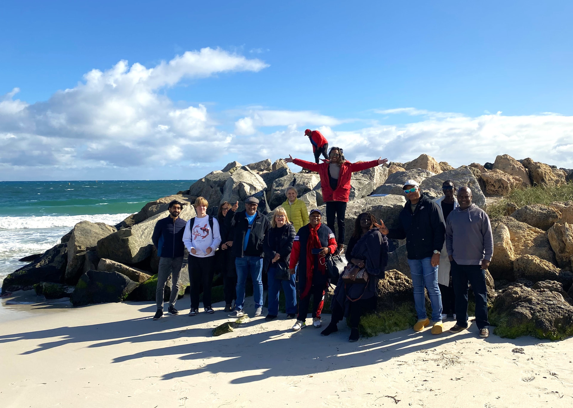 AWBMAMD 2023 delegates on the beach during the Perth conference social programme